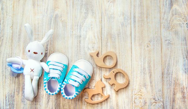 Baby clothes and accessories on a light background. Selective focus. nature.