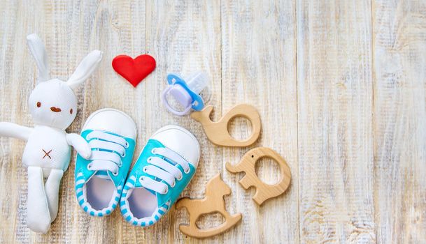 Baby clothes and accessories on a light background. Selective focus. nature.