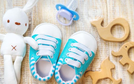 Baby clothes and accessories on a light background. Selective focus. nature.