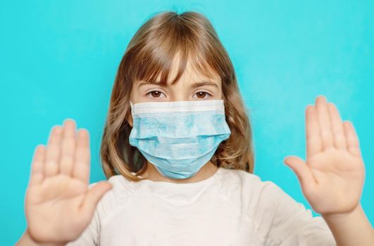 Masked child protection against virus. Selective focus.