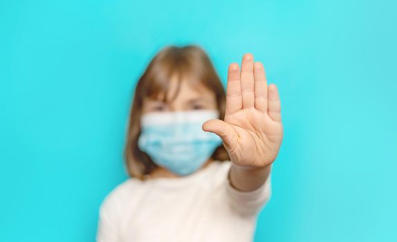 Masked child protection against virus. Selective focus.