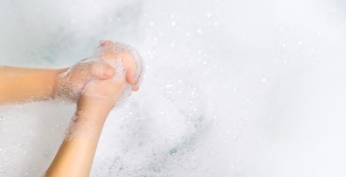 Wash hands thoroughly with soapy water. Selective focus. Hands.