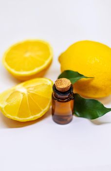 Lemon essential oil on a white isolated background. Selective focus. Food.