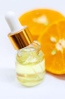 Orange essential oil on a white isolated background. Selective focus. food.