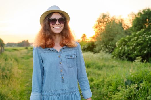 Beautiful teenager girl in jeans dress hat, background scenic landscape, beauty, nature, copy space