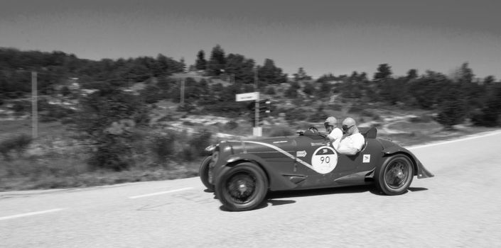 URBINO, ITALY - JUN 16 - 2022 : DELAHAYE 135 CS 1935 on an old racing car in rally Mille Miglia 2022 the famous italian historical race (1927-1957
