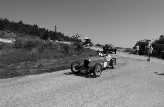 URBINO, ITALY - JUN 16 - 2022 : RALLY ABC 1100 1928 on an old racing car in rally Mille Miglia 2022 the famous italian historical race (1927-1957