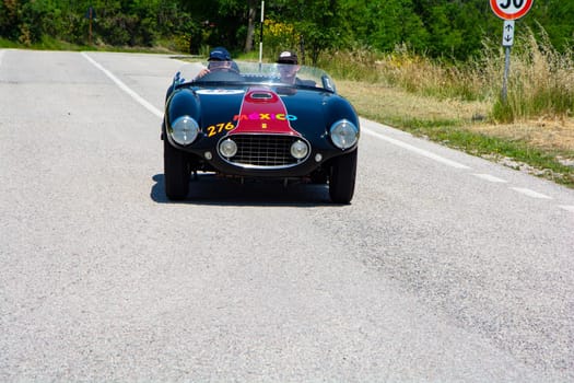 URBINO, ITALY - JUN 16 - 2022 : FERRARI 166 MM SPIDER VIGNALE 1953 on an old racing car in rally Mille Miglia 2022 the famous italian historical race (1927-1957