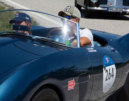 URBINO, ITALY - JUN 16 - 2022 : ASTON MARTIN DB 2/4 BERTONE SPIDER 1953 on an old racing car in rally Mille Miglia 2022 the famous italian historical race (1927-1957