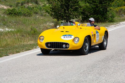 URBINO, ITALY - JUN 16 - 2022 : FERRARI 500 TR SPIDER SCAGLIETTI 1956 on an old racing car in rally Mille Miglia 2022 the famous italian historical race (1927-1957