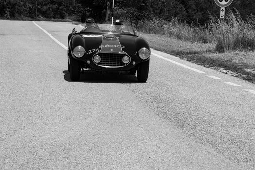 URBINO, ITALY - JUN 16 - 2022 : FERRARI 166 MM SPIDER VIGNALE 1953 on an old racing car in rally Mille Miglia 2022 the famous italian historical race (1927-1957