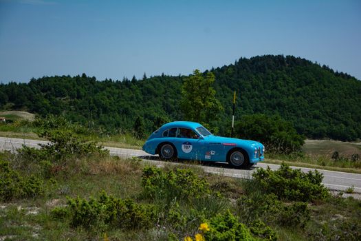 URBINO, ITALY - JUN 16 - 2022 : TALBOT-LAGO T26 GS 1950 on an old racing car in rally Mille Miglia 2022 the famous italian historical race (1927-1957