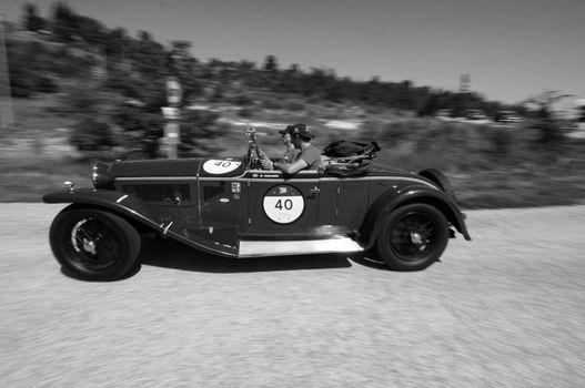 URBINO, ITALY - JUN 16 - 2022 : LANCIA LAMBDA SPIDER TIPO 221 CASARO 1929 on an old racing car in rally Mille Miglia 2022 the famous italian historical race (1927-1957