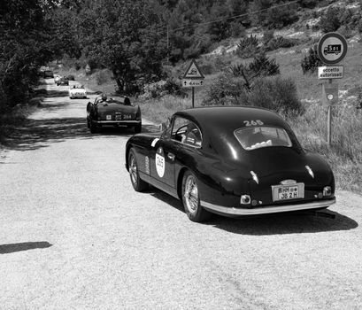 URBINO, ITALY - JUN 16 - 2022 : ASTON MARTIN DB 2 VANTAGE 1953 on an old racing car in rally Mille Miglia 2022 the famous italian historical race (1927-1957