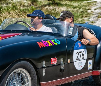 URBINO, ITALY - JUN 16 - 2022 : FERRARI 166 MM SPIDER VIGNALE 1953 on an old racing car in rally Mille Miglia 2022 the famous italian historical race (1927-1957