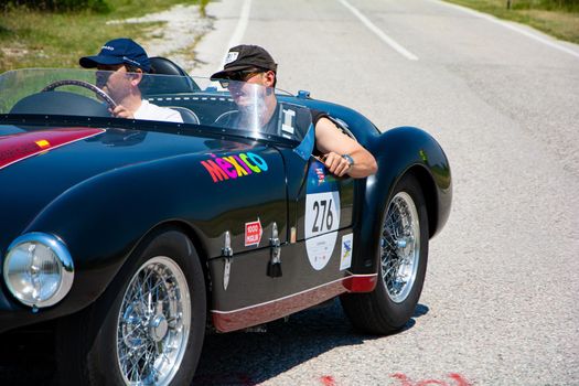 URBINO, ITALY - JUN 16 - 2022 : FERRARI 166 MM SPIDER VIGNALE 1953 on an old racing car in rally Mille Miglia 2022 the famous italian historical race (1927-1957