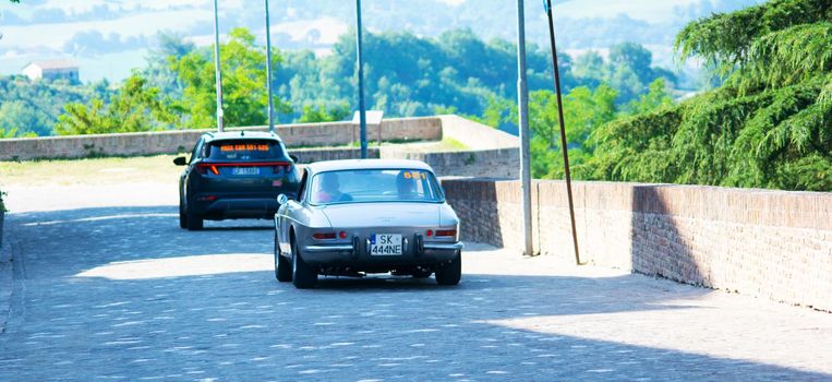 URBINO, ITALY - JUN 16 - 2022 : FERRARI TRIBUTE Ferrari 330 Gtc IN an old racing car in rally Mille Miglia 2022