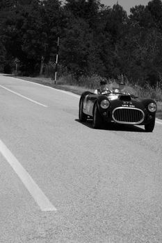 URBINO, ITALY - JUN 16 - 2022 : COOPER BRISTOL T25 BRISTOL 1953 on an old racing car in rally Mille Miglia 2022 the famous italian historical race (1927-1957