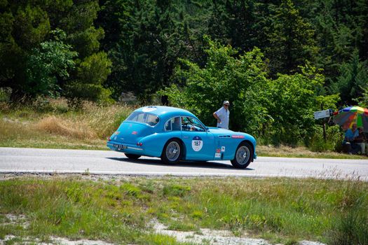 URBINO, ITALY - JUN 16 - 2022 : TALBOT-LAGO T26 GS 1950 on an old racing car in rally Mille Miglia 2022 the famous italian historical race (1927-1957