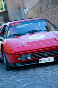URBINO, ITALY - JUN 16 - 2022 : FERRARI TRIBUTE Ferrari 328 gts IN an old racing car in rally Mille Miglia 2022