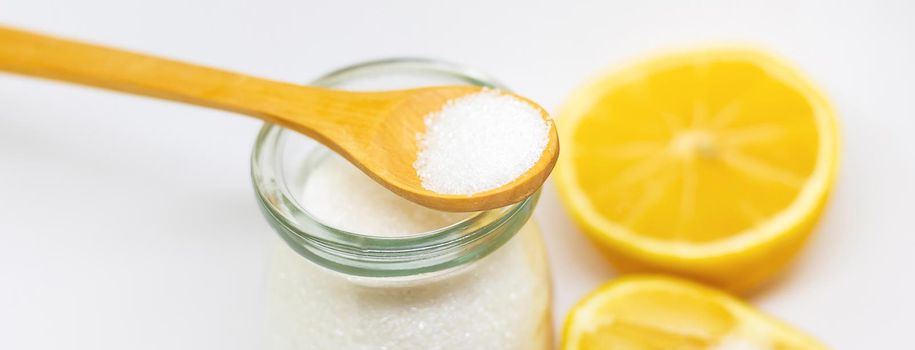 Citric acid on a white isolated background. Selective focus. Food.