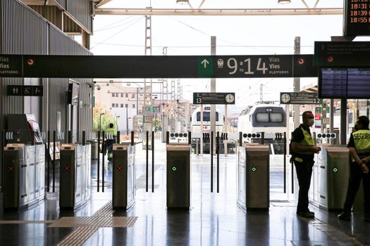 Alicante, Spain- June 24, 2022:Passengers walking through the train station of Alicante with suitcases