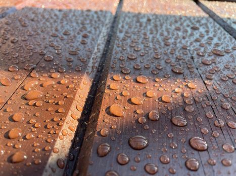 Lots of water drops on dark wood background