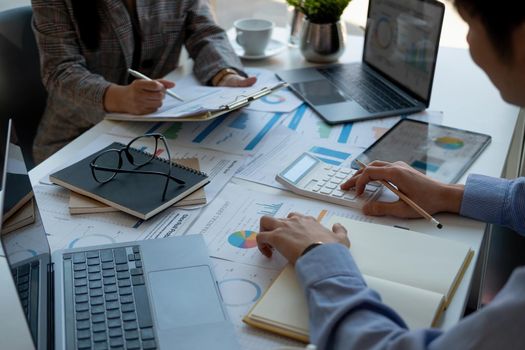 Business people are meeting for analysis data figures to plan business strategies. Business discussing concept.
