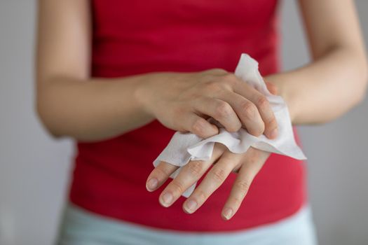 Cleaning hands with baby wet wipes, prevention of infectious diseases, stock photo