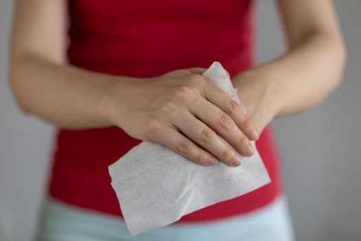 Cleaning hands with baby wet wipes, prevention of infectious diseases, stock photo