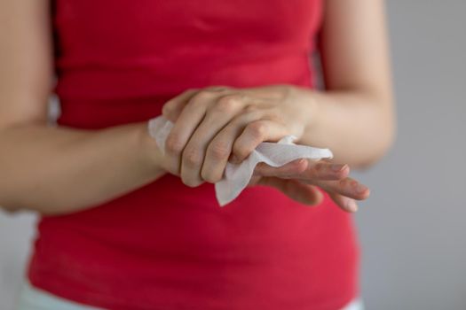 Cleaning hands with baby wet wipes, prevention of infectious diseases, stock photo