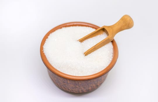 White sugar on a white isolated background. Selective focus. food.