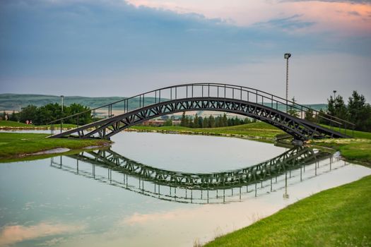 Pond with reflection in golf grassland