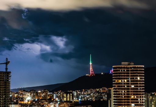 Dramatic evening sky with flashlight during thunder in Tbilisi, Georgia