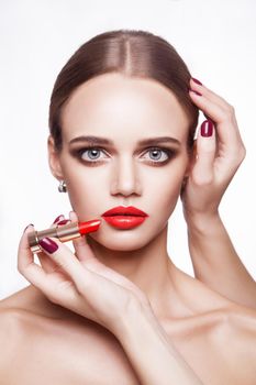 Closeup portrait of woman hand apply makeup on face. beauty and health care concept.