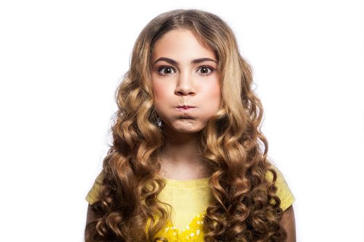 Portrait of bored girl with wavy hairstyle and yellow t shirt. studio shot isolated on white background.