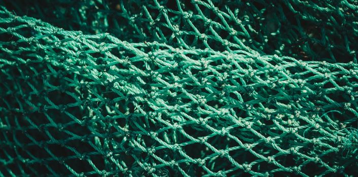 BANNER abstract close-up macro real photo beautiful wallpaper. Fisherman rope net texture fiber surface pattern. Sea blue green light colour. Futuristic subtle waving lines art modern Dark background