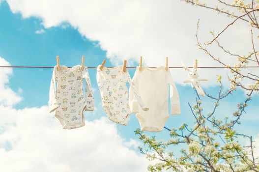 Baby clothes are drying on the street. Selective focus. nature.