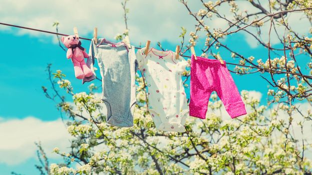 Baby clothes are drying on the street. Selective focus. nature.