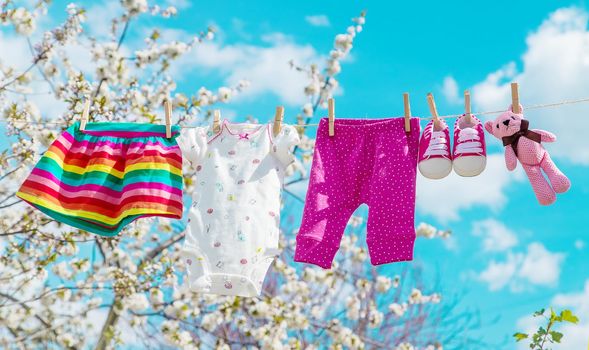 Baby clothes are drying on the street. Selective focus. nature.