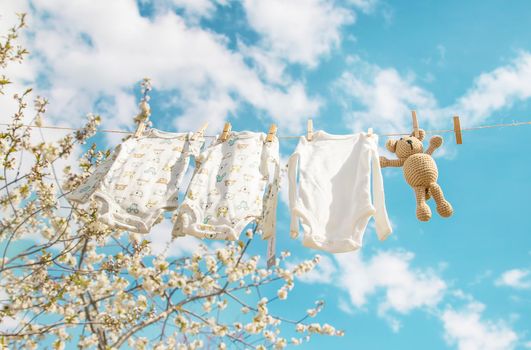 Baby clothes are drying on the street. Selective focus. nature.