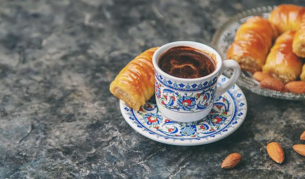 A cup of Turkish coffee and baklava. Selective focus. Drink.