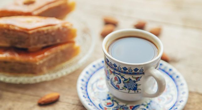 A cup of Turkish coffee and baklava. Selective focus. Drink.