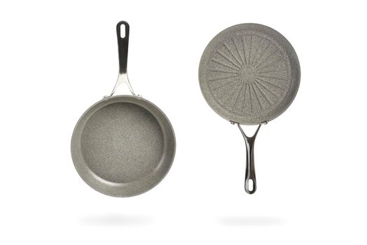 Gray frying pan isolated on white background. Frying non-stick frying pan made of titanium and granite. Isolate with shadow.