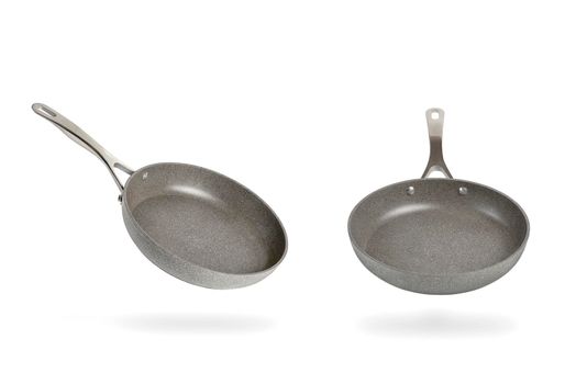 Gray frying pan isolated on white background. Frying non-stick frying pan made of titanium and granite. Isolate with shadow.