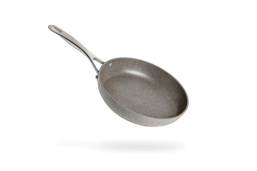 Black frying pan isolated on white background. Frying pan with non-stick coating.Non-stick frying pan made of titanium and granite. Isolate with shadow.