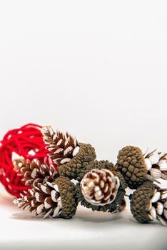 Christmas banner, isolate on white, cones and red berries are laid out on a white background. For print, postcard, design with place for text