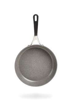 Black frying pan isolated on white background. Frying pan with non-stick coating.Non-stick frying pan made of titanium and granite. Isolate with shadow.