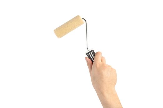 Paint roller in a man's hand. Renovation concept. Supplies and tools for painting walls isolated on white.