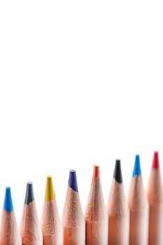 Isolate of multicolored wooden pencils. Pencils of different colors ,arranged in a rowstand out against a uniform white background, for insertion into a project or for printing a banner or label